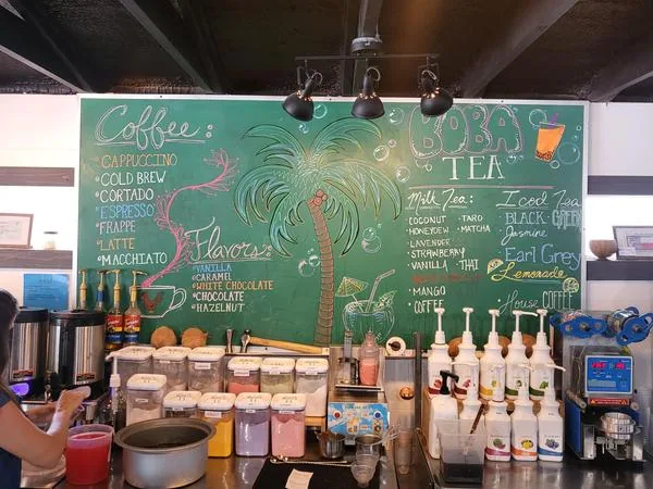 Coconut Cowboys coffee shop counter in Bandera with espresso machine and menu board