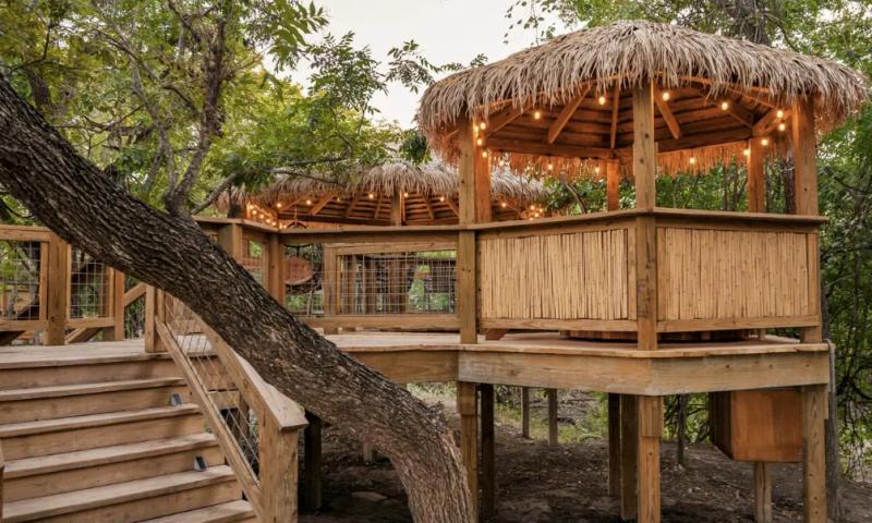 Blue Jay Yurt — private raised gazebo connected by a wooden walkway.