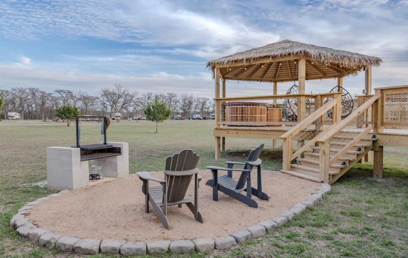 King Fisher Yurt — private fire pit and gazebo beside the elevated yurt.