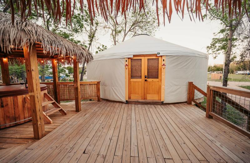 Love Bird Yurt — view across the gazebo deck to the yurt's cedar double doors.