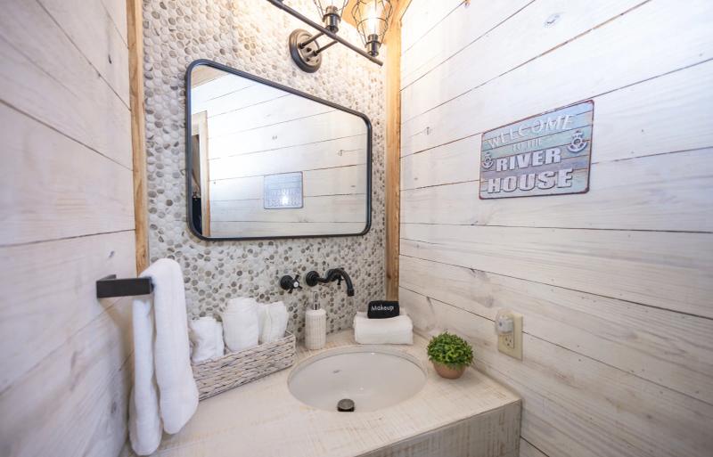Mourning Dove Yurt — private vanity with patterned tile and fresh white towels.